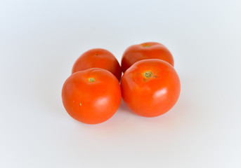 ripen tomatoes isolated on white background. selective focus.