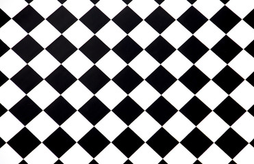 Black and white checkered floor tiles seamlessly as a pattern, top view - Powered by Adobe