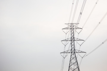 Photograph of high voltage power tower during the storm close up.