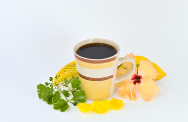 a cup of coffee with tropical flowers isolated on white background. selective focus.