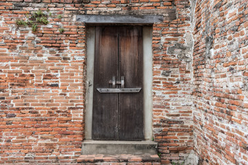 wooden door on old brick wall, Ayutthaya