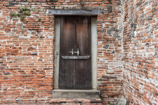 wooden door on old brick wall, Ayutthaya