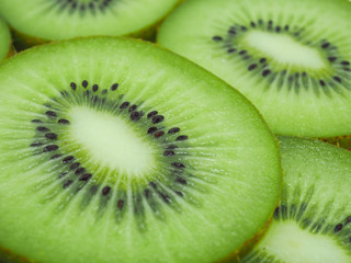 Naklejka na ściany i meble Slice of fresh juicy delicious and healthy kiwi fruit, close up