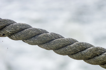 old marine rope on the pebble beach