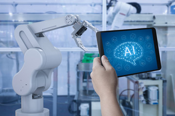 Technician control 3d rendering robot arm in factory with tablet.