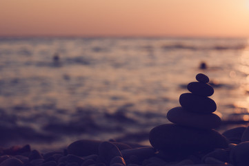 stack of zen stones on pebble beach