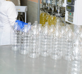 Sunflower oil factory. Factory line of production and filling of refined oil from sunflower seeds.