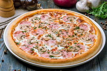 Pizza with ham and mushrooms