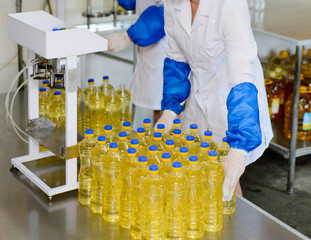 Sunflower oil factory. Factory line of production and filling of refined oil from sunflower seeds.