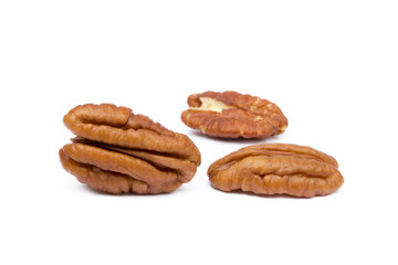 Fototapeta na wymiar Fresh pecan nuts isolated on a white background