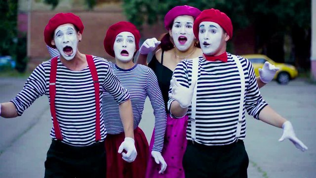 Four mimes imitate car accident at the city
