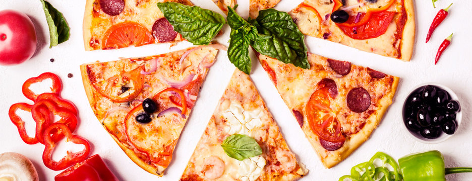 selection of Assorted pieces pizza on white background and ingredients. Pepperoni, Vegetarian and Seafood Pizza