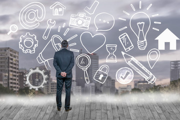 Businessman looking at business concept against cityscape