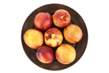 nectarine on a plate isolated