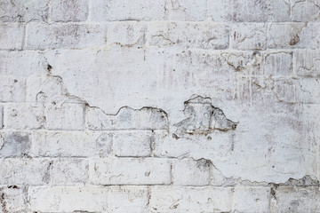 Texture of old white painted brick wall