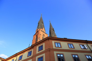 Beautiful view on top tower on blue sky background. Gorgeous backgrounds. Architecture concept.