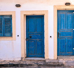 Blue doors and window with closed shutters - Greece, Crete.