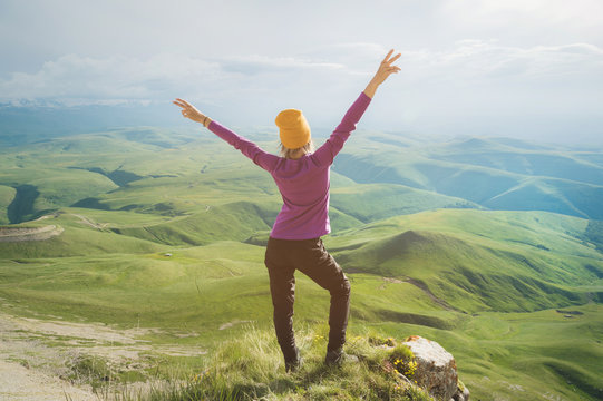 Young Woman Feeling Strong And Confident On The Outdoor Against Green Valley