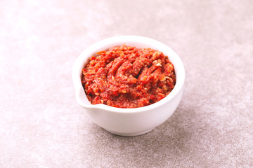 Traditional Maghrebi hot chili pepper sauce paste harissa. adjika