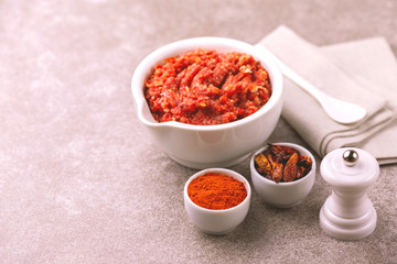 Traditional Maghrebi hot chili pepper sauce paste harissa. adjika