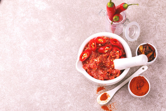 Traditional Maghrebi hot chili pepper sauce paste harissa. adjika