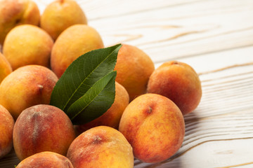 Naklejka na ściany i meble fresh peaches in a plate on the table