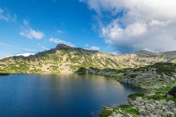 Naklejka na ściany i meble Popovo lake at Bezbog, Bulgaria and mountains reflection.