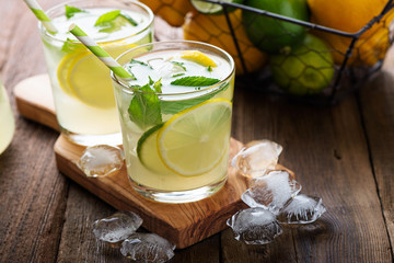 Lemonade. Drink with fresh lemon and lime. Cocktail with juice and ice.