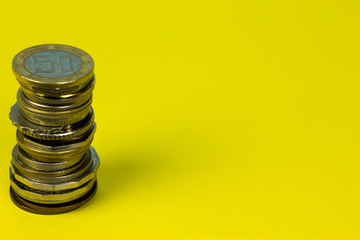 Different coins tower. Free Copy space