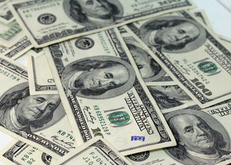 Cash of hundred dollar bills. A pile of one hundred US banknotes .100 Dollar.