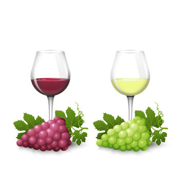 Glass glasses with white and red wine and bunches of grapes