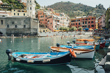 Fototapeta na wymiar Boats in the Vernazza bay in National park Cinque Terre, Liguria, Italy