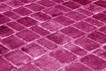 Fototapeta premium Cobble stone pavement in pink tone.