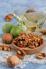 Organic walnut oil in glass cup.