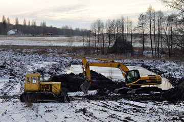 yellow excavator and bulldozer