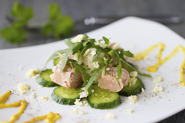 Salad with canned tuna, boiled egg and fresh cucumber.
