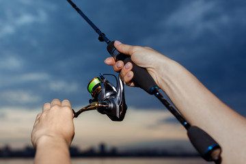 Fishing in the river at sunset.