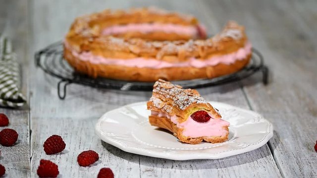 Homemade choux pastry cake Paris Brest with raspberries. French dessert.
