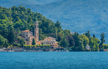 Fototapeta na wymiar Scenic view in Tremezzo, with San Lorenzo Church overlooking Lake Como. Lombardy, Italy.