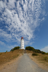 Fototapeta na wymiar traumhafte Schäfchenwolken über dem Leuchtturm., Insel Hiddensee, Rügen