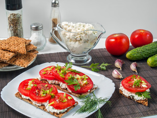 Crispy buckwheat bread with tomatoes, creative cheese, greens
