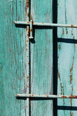 Texture of turquoise rural wooden planks and metal rods