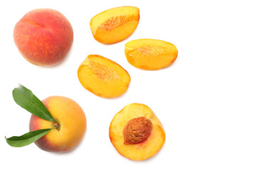 peach fruit with green leaf and slices isolated on white background. top view