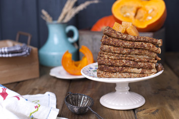 Delicious homemade pancakes for breakfast, with pumpkin and honey. Breakfast for the whole family. Rustic photo. Copy space,