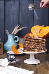 Delicious homemade pancakes for breakfast, with pumpkin and honey. Breakfast for the whole family. Rustic photo. Copy space,