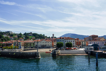 Fototapeta na wymiar Luino, the beautiful town seen by tourists arriving by boat. Lake Maggiore, Italy