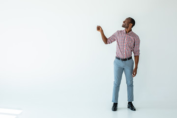 Joyful afro american man holding an umbrella