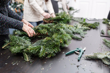 Manufacturer of Christmas wreath from branches of pine for holiday. Master class on making...