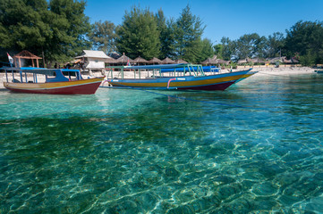 Fototapeta na wymiar Ferry boats moored on the beach, Gili Air, Gili Islands, Indonesia