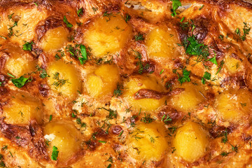 Baked potatoes in a roasting pan. Top view.